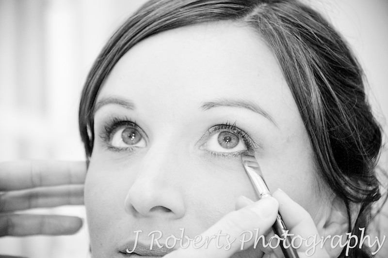 Nervous bride having her make-up applied at home in Roseville - Wedding Photography Sydney